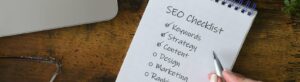 Female checking off items on SEO checklist - search engine optimization