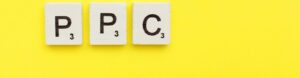 PPC scrabble letters word on a yellow background